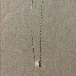 Sterling silver necklace with rough “floating stone”